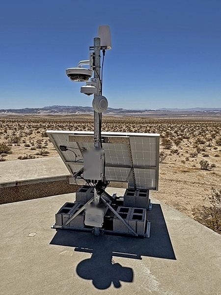 Ballasted solar camera mast at a remote desert site