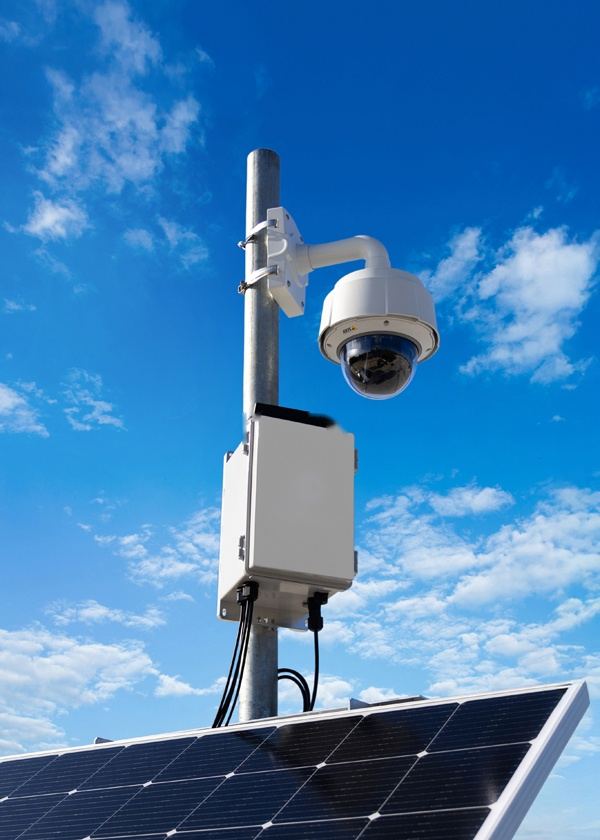 PTZ dome camera on a pole above a solar-powered power unit
