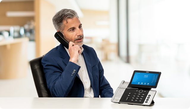 Wildix desk phone in use