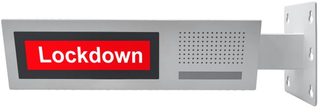 Double-sided LCD clock speaker showing a lockdown alert