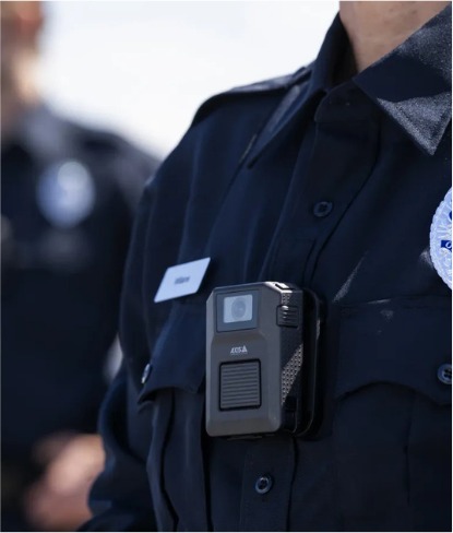 Security officer wearing a black AXIS body worn camera
